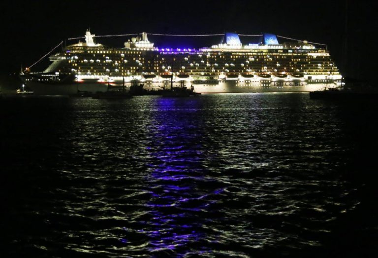 Cruise ships give the harbor a beautiful glow at night